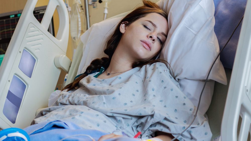 A patient resting in a hospital bed