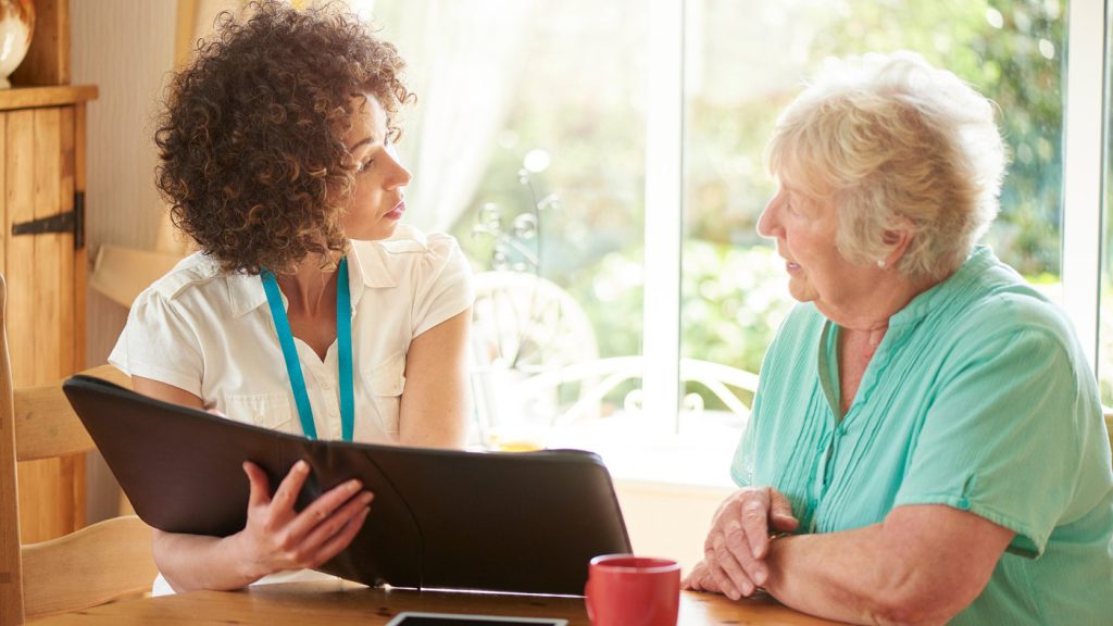A licensed insurance agent going through Medicare plan options with a client